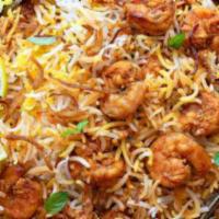 Shrimp Biryani · A unique layered royal style biryani succulent shrimp pieces slowly cooked with special Indi...