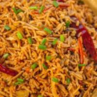 Szechwan Chicken Fried Rice · Cooked basmati rice is tossed with red hot schezwan sauce and veggies & chicken