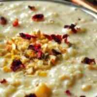 Rice Kheer · Indian dessert made with broken rice, sugar, and condensed milk. Garnished with nuts.