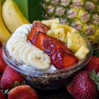 Island · Acai base topped with granola, banana, pineapple, strawberry, coconut flakes, chia seeds, ho...