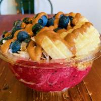 Beach · Pitaya base topped with granola, banana, blueberry, coconut flakes, almond butter, honey