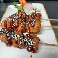 Fried BBQ Chicken Skewers · Toasted sesame & cilantro.