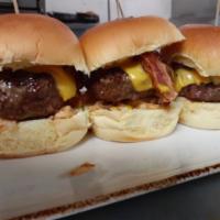 Cheeseburger Sliders · American cheese, spicy mustard, smoked bacon, crispy shallots on mini parker rolls.
