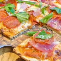 Tour of Italy Flatbread Pizza · Mozzarella, coppa ham, pepperoni, San Marzano tomato sauce, chili flakes.