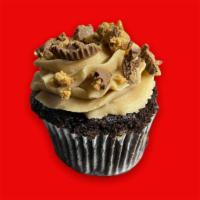 Chocolate Peanut Butter Cupcake · Our double dutch chocolate cake topped with peanut butter  buttercream and Reese’s.

Contain...