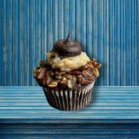 Dutch German Chocolate Cupcake · Our double dutch chocolate cake filled with made-from-scratch coconut pecan filling and topp...