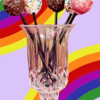 Cake Pops · Fully baked cake mixed with buttercream and dipped in chocolate/white chocolate. Has a dough...