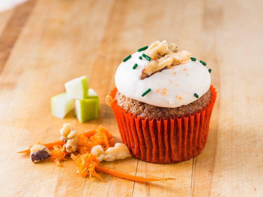 Spiced Carrot cupcake · Carrot cake with apples & walnuts topped with a spiced cream cheese. Definitely a top favorite.