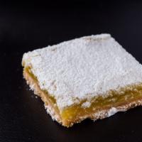 Lemon Tart Squares** · Our tart lemon squares topped with fine powdered sugar on a soft flaky crust. A topseller.