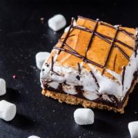 S'mores Campfire Bar*** · Our top selling bar: Graham cracker crust, marshmallows, rich ganache, topped with torched m...
