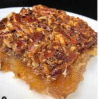 Pecan Pie Bar · A rich heavy layer of pecan pie filling in between a shortbread crust, topped with toasted p...