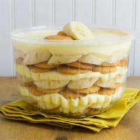 Famous Banana Pudding · Layers of luscious vanilla pudding with vanilla wafers and bananas.