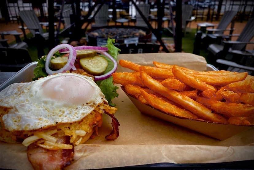 The Hangover Cure Burger · Our burger topped with bacon, hash browns, cheddar cheese and a fried egg.
