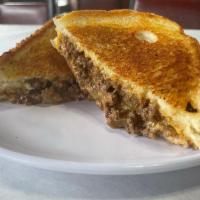 Chopped Grilled Cheese · 6 oz Angus Beef Patty chopped w/ onions & cheese in between 2 thick slices of Texas Toast
