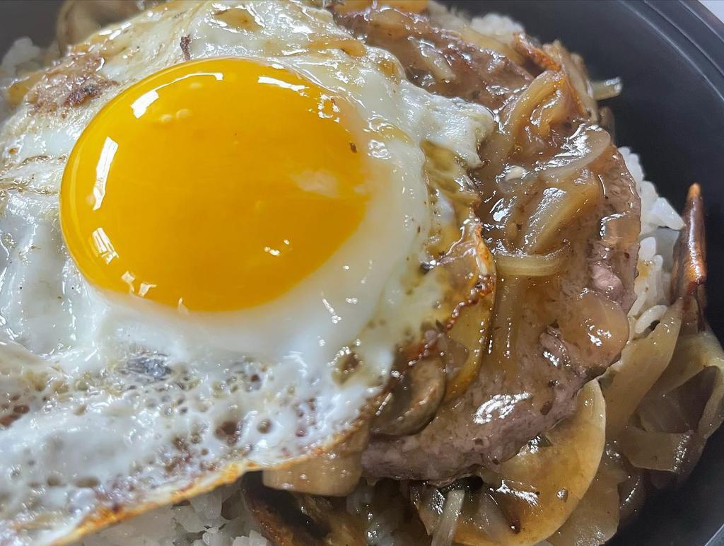 Loco Moco Burger · 6 oz angus beef patty on a bed of white rice, topped with sautéed onions, mushrooms, gravy and fried eggs.