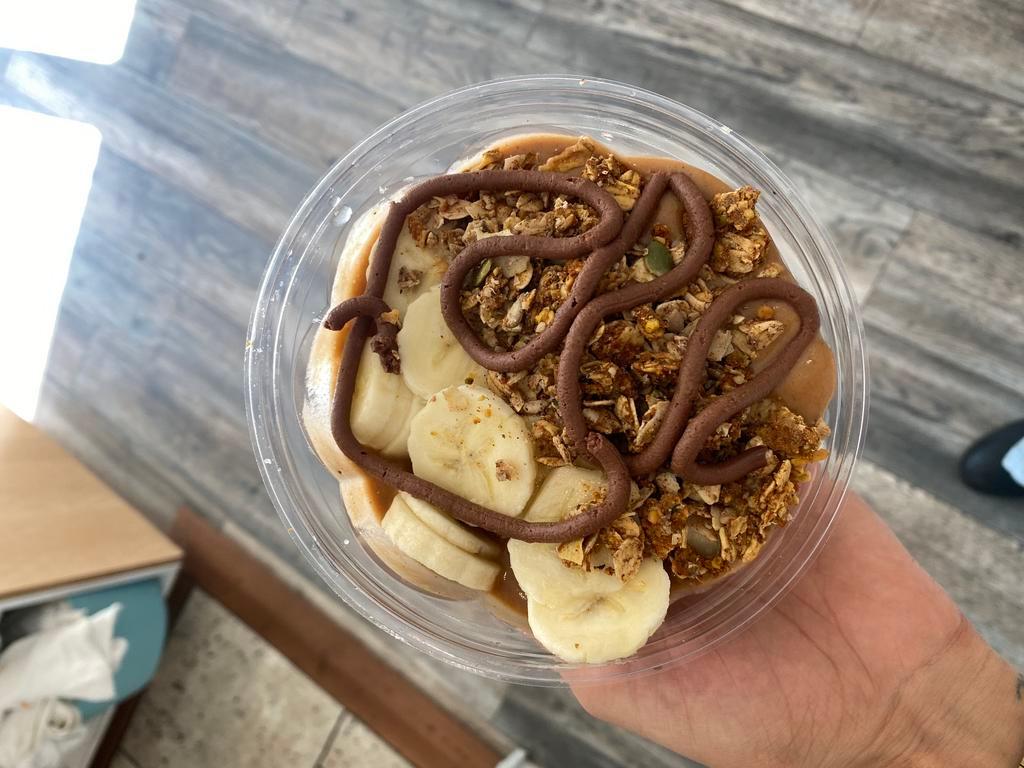 Power Pumpkin · house-made pumpkin spice puree, bananas, chocolate protein, maca, lion's mane, oat milk. topped with granola, banana slices, nutella drizzle