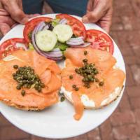 Bagel and Nova Platter · Your choice of toasted bagel served as a platter with Nova Lox, capers, onion, tomato, side ...