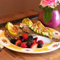 Avocado Toast on 7 Grain · 7 grain toast topped with fresh avocado, homemade pickled onions, and 
