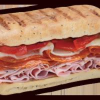 Sicilian Panini · Slow-cured ham, prosciuttini, pepperoni, provolone and roasted red peppers with creamy Itali...