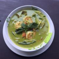 62. Green Curry · Eggplant, basil, bamboo shoot, string beans, carrots and bell pepper in coconut green curry....