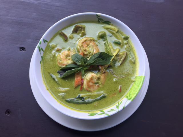 62. Green Curry · Eggplant, basil, bamboo shoot, string beans, carrots and bell pepper in coconut green curry. Spicy.
