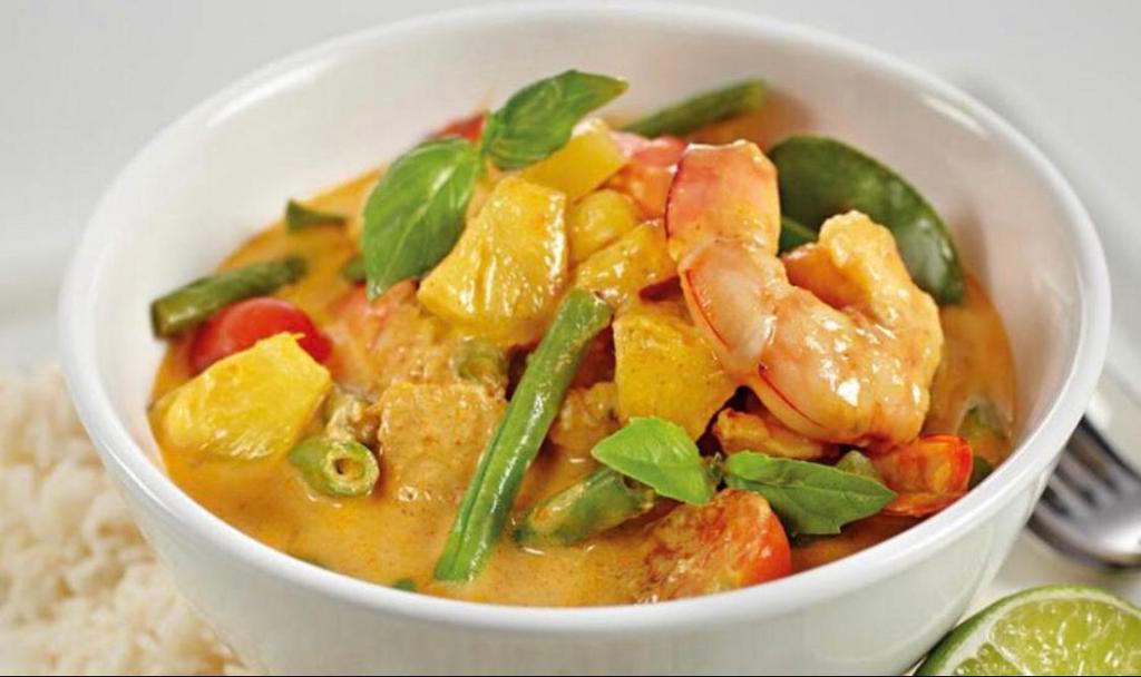 67. Pineapple Curry · Pineapple, basil, bell pepper, tomatoes and green peas in coconut curry. Spicy.