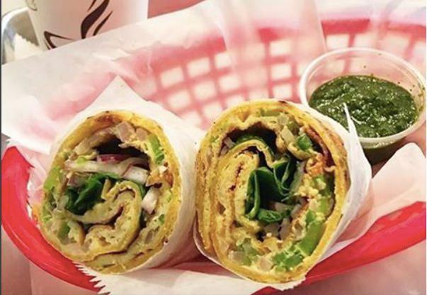 Galli Omelette Kathi Roll · Eggs, bell peppers, onions, and tomatoes garnished with mint-cilantro chutney and red onions. Gluten free.