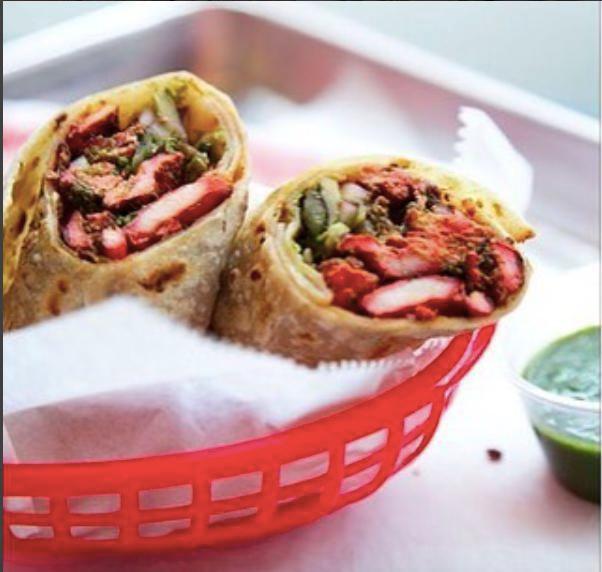 Chicken Tikka Kathi Roll · Chicken marinated in spiced yogurt and garnished with mint-cilantro chutney and red onions. Gluten free.