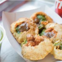 Vegan Pani Puri · 6 pieces. Gujarati style puri filled with spiced potatoes and a spicy water mixture. Vegetar...