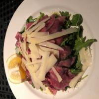 Beef Carpaccio · With arugula and shaved Parmigiano.