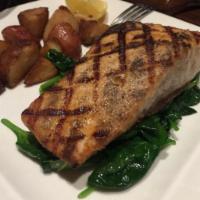 Grilled Salmon · Spinach and roasted potatoes.