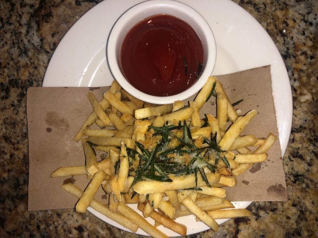 Truffle Fries · truffle oil, parmesan cheese and rosemary.