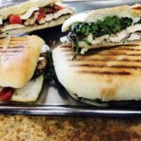 Grilled Sausage Panini · With thinly sliced eggplant, roasted red peppers, fresh mozzarella and sliced black olives. 