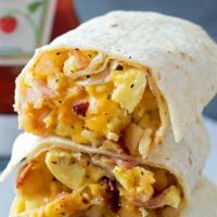 Breakfast Burrito · 2 eggs, choice of protein, and cheese in a flour tortilla.