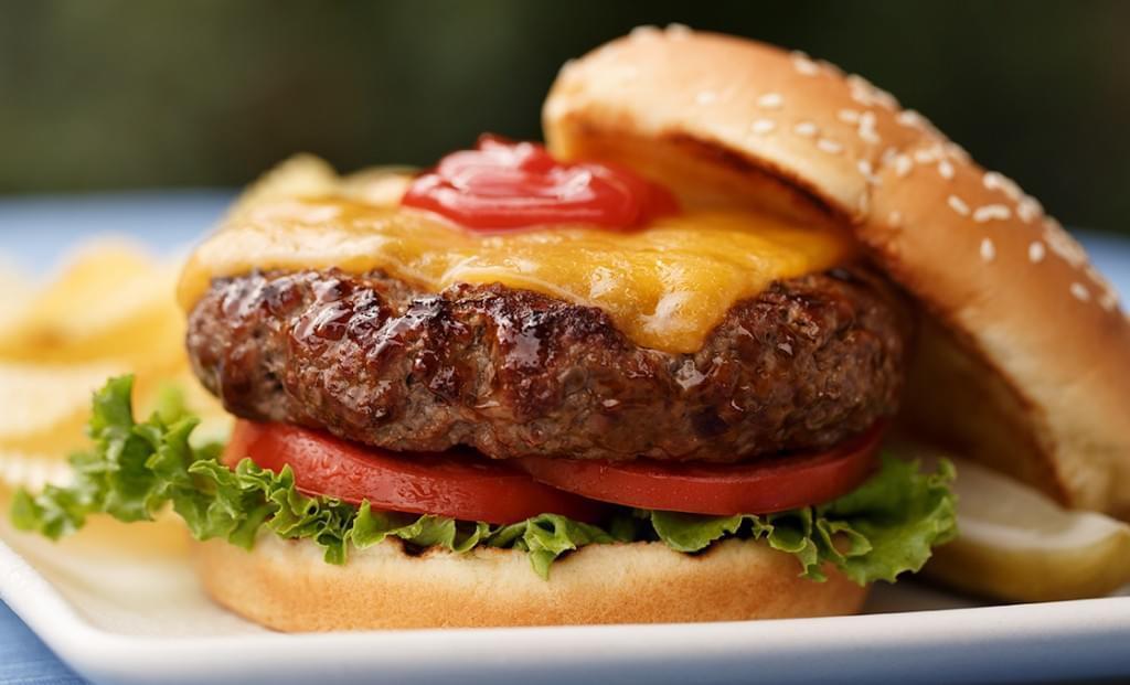 Hamburger with Cheese · A hamburger is a food, typically considered a sandwich, consisting of one or more cooked patties—usually ground meat, typically beef—placed inside a sliced bread roll or bun. The patty may be pan fried, grilled, smoked or flame broiled