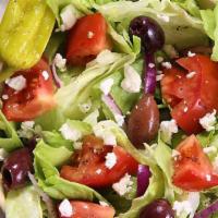 5. Greek Salad · Romaine lettuce, feta cheese, grape leaves, tomatoes, olives, onions, and balsamic vinegar.
