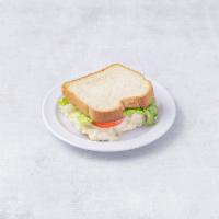 Egg Salad Sandwich · Served with lettuce, tomatoes, and a choice of bread.