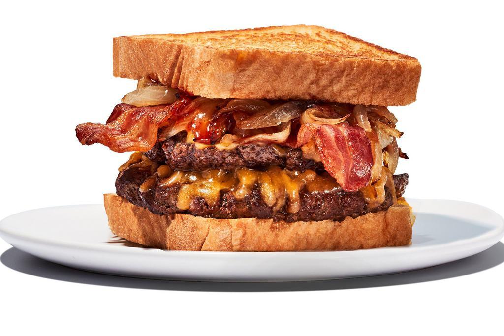 Twisted Texas Melt · 2 1/4 lb. patties. Yippee kai yay, hungry trucker! Beef meets caramelized onions, bacon, and cheddar cheese, fully loaded with a layer of our Daytona Beach sauce and served on Texas toast.