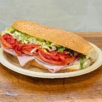 Italian Grilled Hero · Ham, salami, pepperoni, provolone, lettuce, tomato, sweet peppers and oil and vinegar.