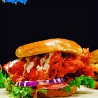 Kick- In  Chicken Sandwich · Fried Chicken, on Texas Toast, tossed in Famous Hot sauce, lettuce, tomato, & Ranch