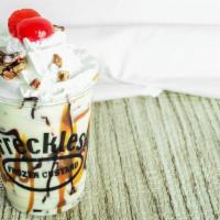 Snappy Turtle · Custard topped with hot fudge, caramel, roasted pecans, whipped cream and a cherry.
