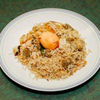 Goat Biryani · Goat with long grain basmati rice and flavored with saffron herbs and saffron.