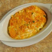 Funeral Potatoes w/ Garlic Bread · A tasty local favorite with Robintino's flare. One slice of garlic bread included.