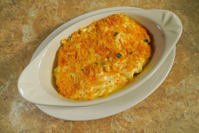 Funeral Potatoes w/ Garlic Bread · A tasty local favorite with Robintino's flare. One slice of garlic bread included.