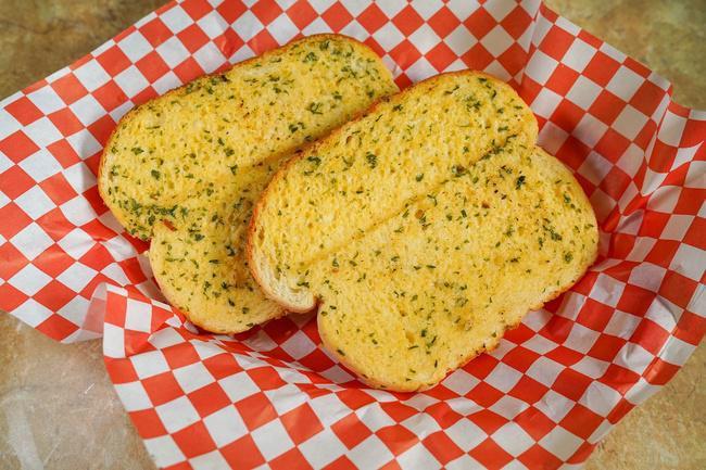 2 Slices Garlic Bread · Our signature garlic spread on Texas toast; toasted to perfection. Comes in two slices.