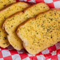 Garlic Bread · Our signature garlic spread on Texas cut toast. Comes in either 2 or 4 slices.