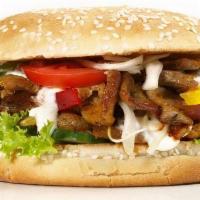 Gyro Cheese Burger · Served with onion, tomato, gyro sauce, and cheese.