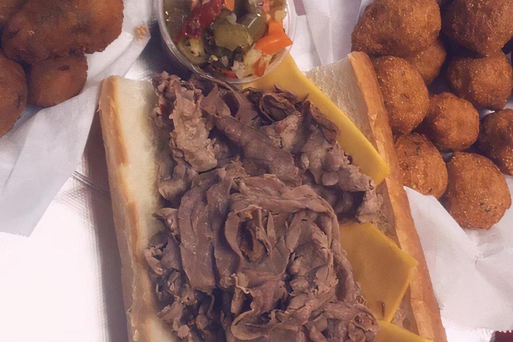 Italian Beef · Composed of thin slices of seasoned roast beef, simmered and served on a long Italian-style roll.