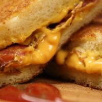 Grilled Cheese Sandwich with Bacon · Served on a homemade bread.