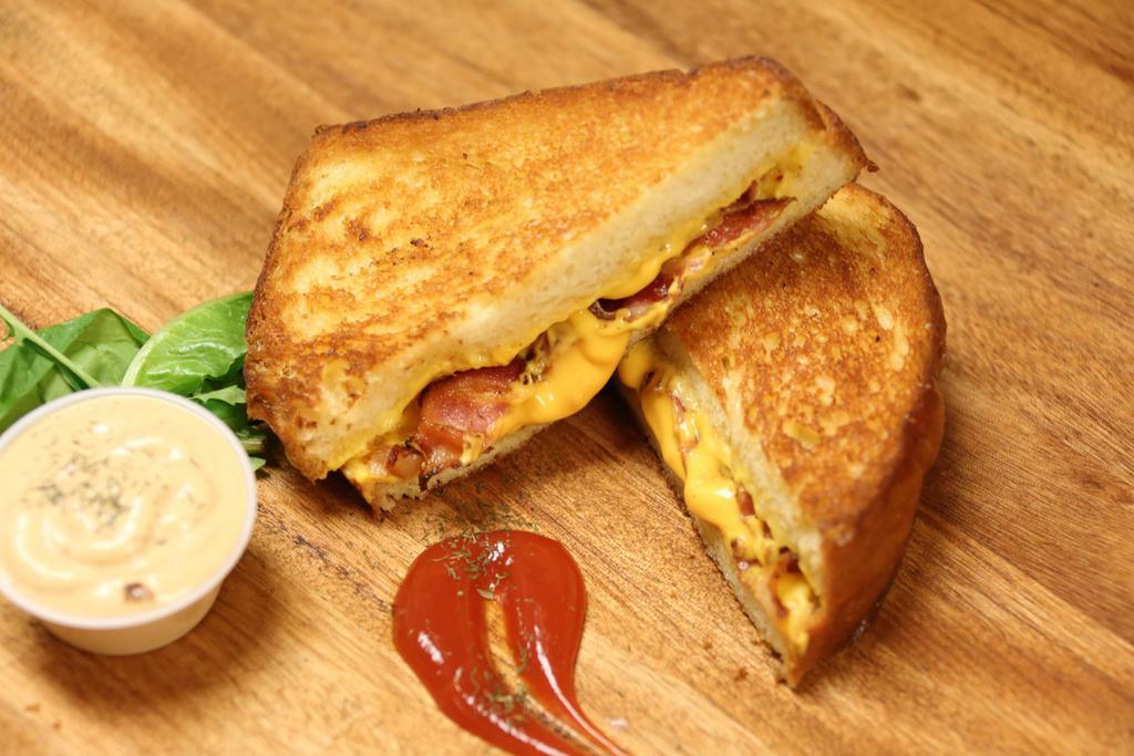 Three Cheeses Grilled Cheese Sandwich · Homemade bread, American, Cheddar and Swiss cheese.